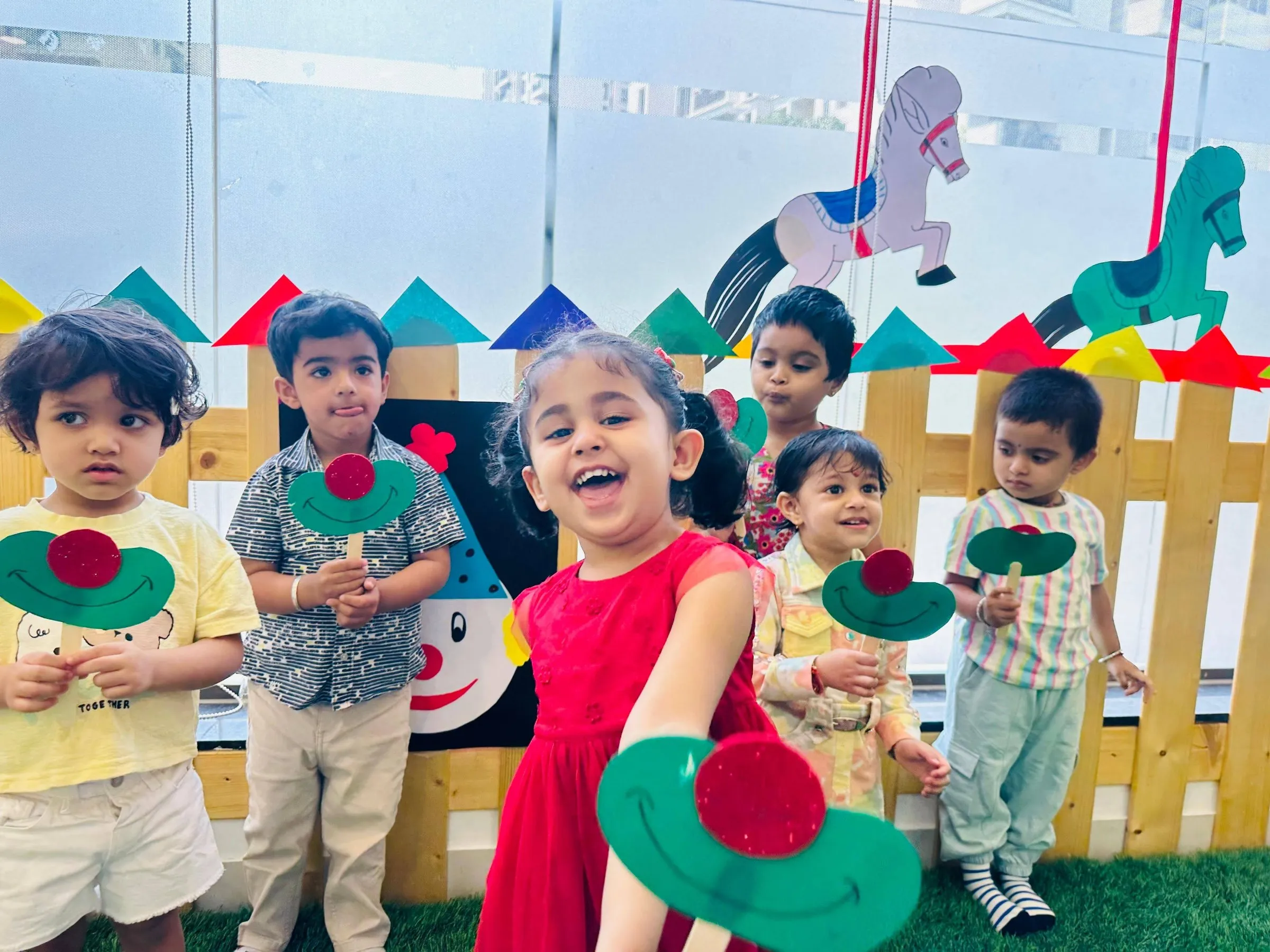 Colourful indoor play area with rockers and a slide at a Crossmaze centre