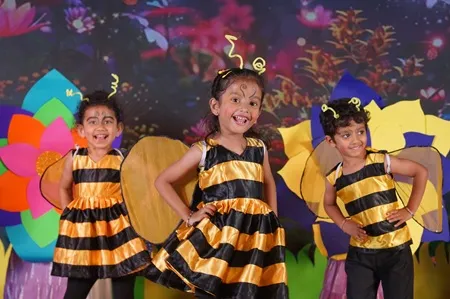 Children dressed as bees at the Crossmaze annual day