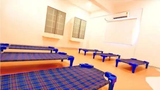 Air-conditioned nap room with child-sized cots